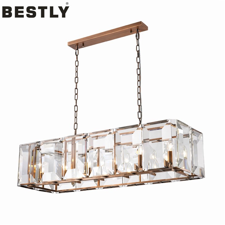 Lång taklampa med klart glas i röd kopparfinish